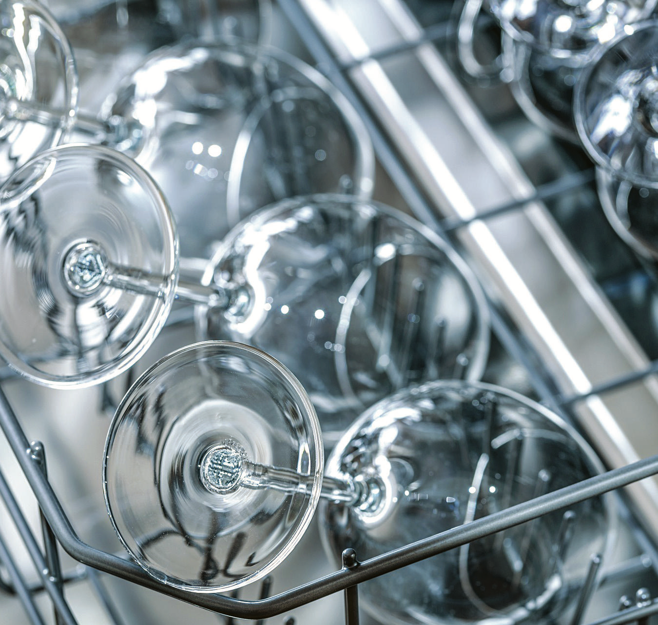 Drinking glasses arranged in a dishwasher